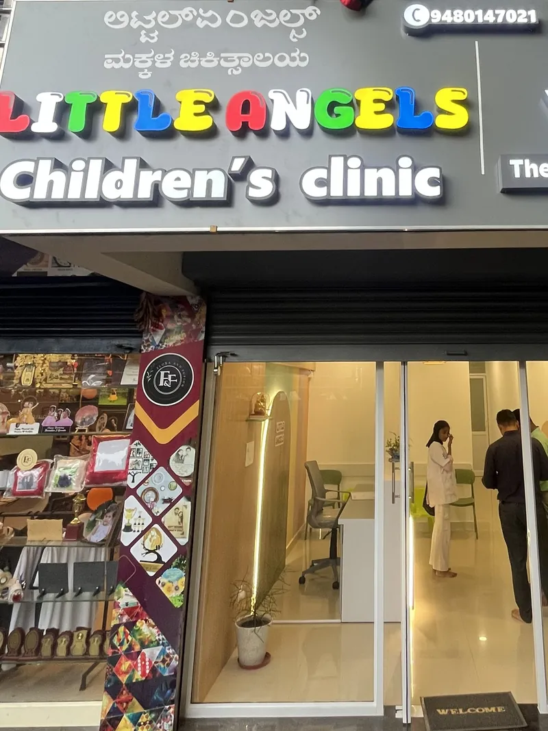 Shopfront of Little Angels Children's Clinic with its illuminated sign
