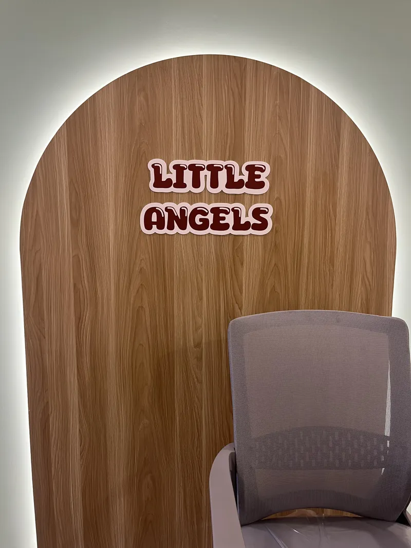 The Little Angels lettering on the panelled arch